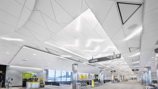 The corridor ceilings totaled more than 26,000 square feet. Three different panel shapes were used – 45o left parallelograms, 45o right parallelograms, and 45o triangles. 