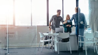 Architects shaking hands in an office