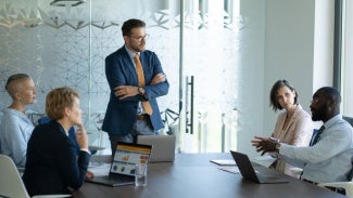 Team members working together at a table in an office setting