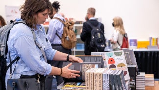 Shopper browsing books at the AIA Design Shop
