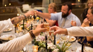 Group toasting champagne during an event at the AIA Global Campus.