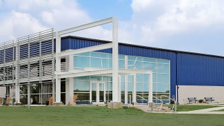 exterior of metal-sided blue building at Iowa Lakes Community College