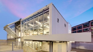 exterior of pre-engineered metal building with glass wall
