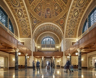 Beaux arts style great hall with gold detail at the National Academy of Sciences Headquarters.
