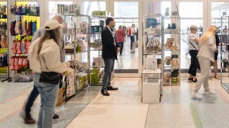 Customers browsing and shopping for products at the AIA Design Shop.