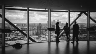 Business people overlooking a city