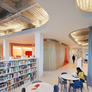 Library interior showing exposed ceiling and other design elements