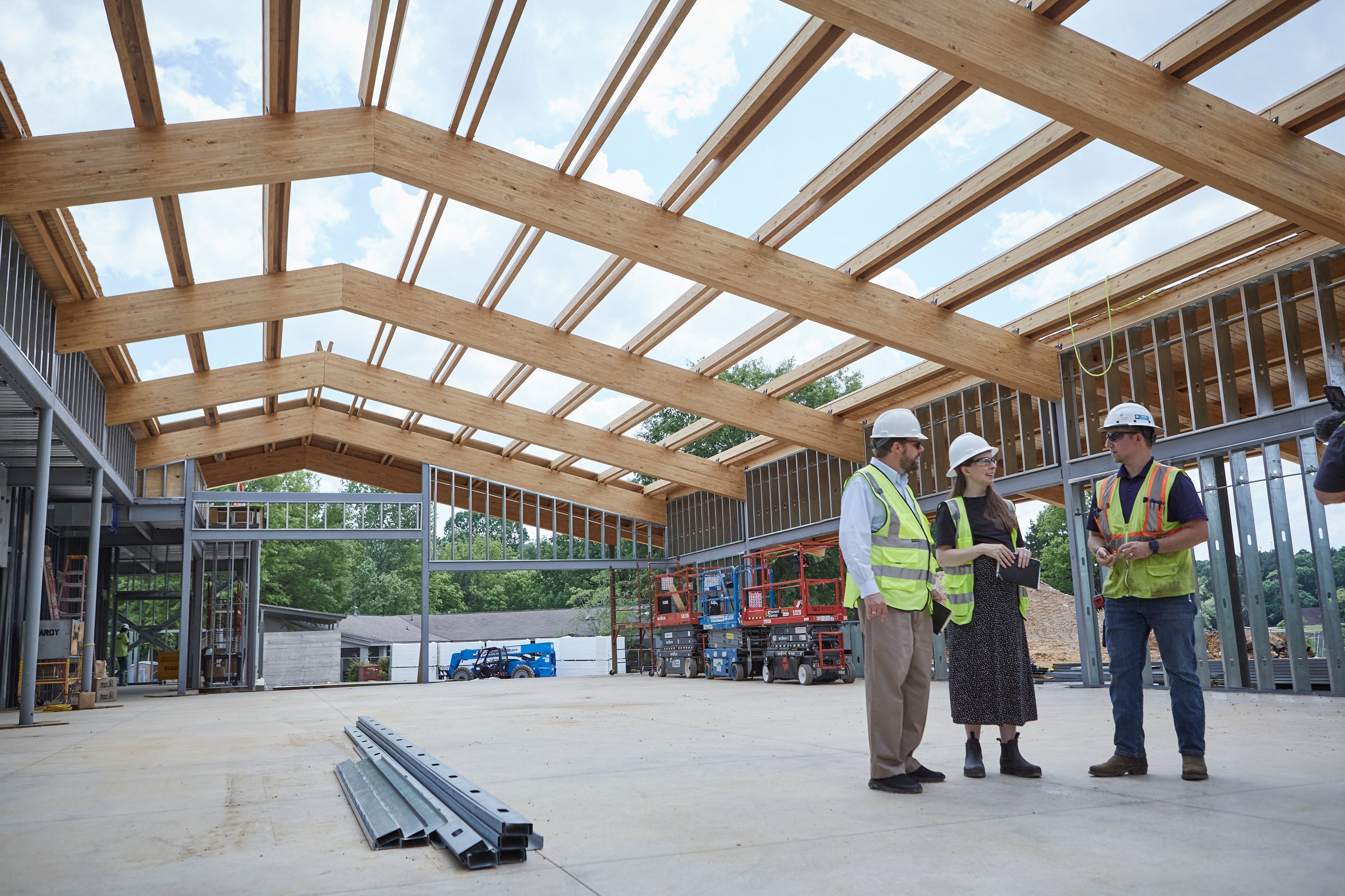 Group of diverse architects collaborating on a construction site.
