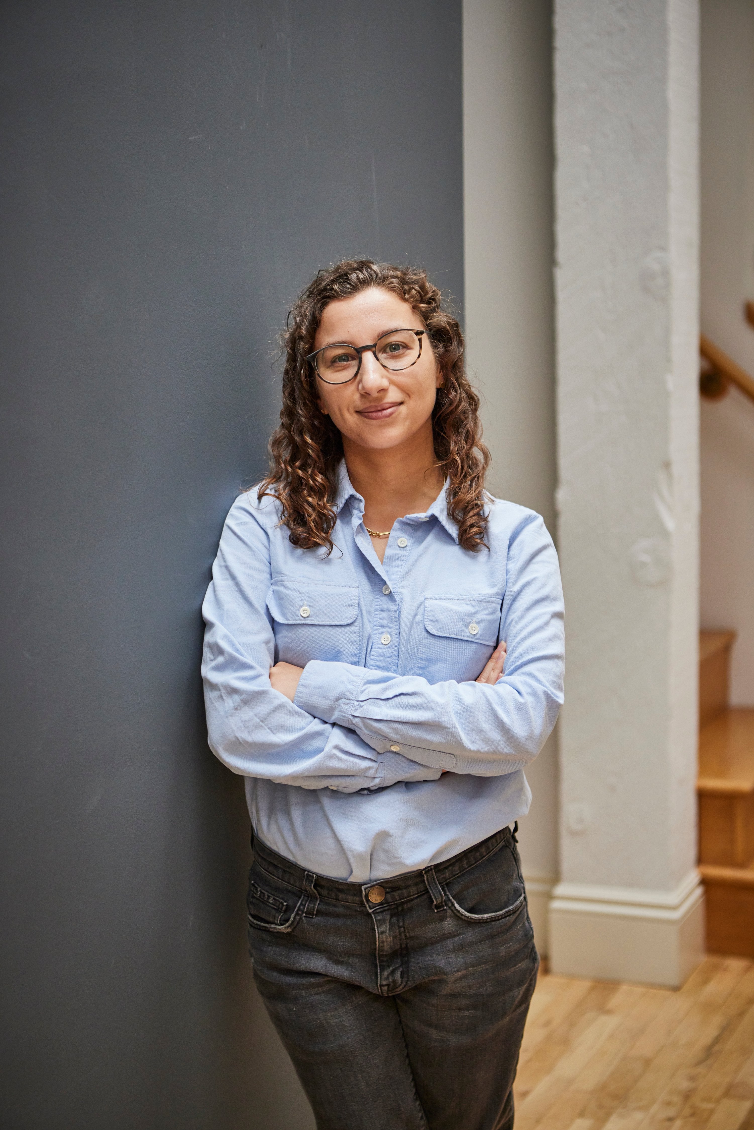 Young female architect smiling at camera.