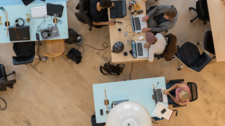 Aerial view of people working at desks at an office