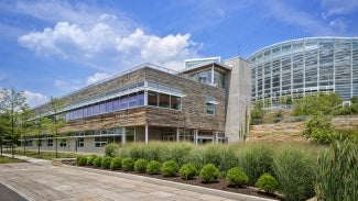 building with green shrubbery out front