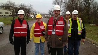 people in vests support the disaster assistance program