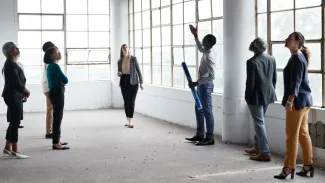 Group of people looking at the ceiling