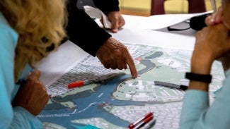 Community stakeholders identifying areas for intervention along the Maryland line trail.