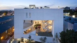 white futuristic building at dusk