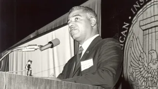 Black and white photo of Whitney M. Young Jr. speaking at the 1968 AIA Convention