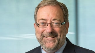 Headshot of man in glasses with beard
