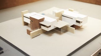 Image of a building model on a blank surface