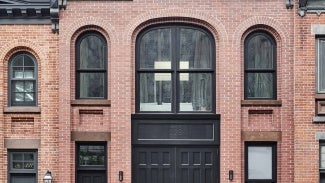 Red brick exterior of Fisher & Payne mass timber project