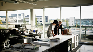 Two architects gathering at a desk