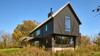 Moger compares the form of the home to a milk carton because the poured-concrete shell allowed them to cut away sections to create large openings without weakening the structure.