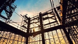 Construction site on sunset background.