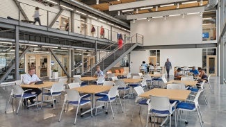 The building establishes several social gathering points along a circular circulation corridor, in addition to the science and engineering program areas