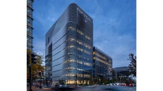 High Performance Ribbons: Folded ribbons of stainless steel define the exterior expression of EXP. This sinuous wrapper pinwheels around the building responding to both the solar exposure and the program, tapering open and closed to express varying levels of solid and transparent screening.