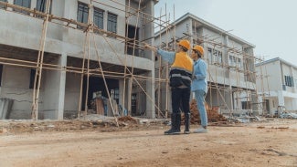 architects work on a housing project site