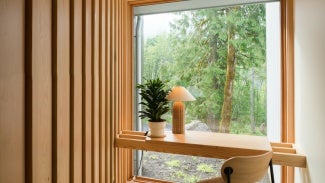 Silver Residence interior, a built-in desk in front of an Andersen windows.