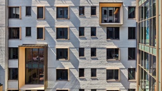 Courtyard East wall, from West, with pop-out study rooms.