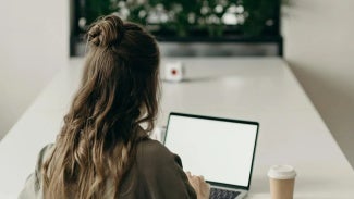 Woman at desk on her computer