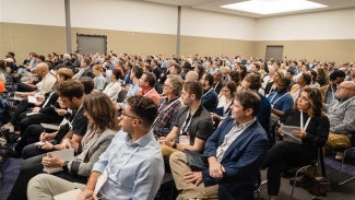 Room full of people at annual business meeting