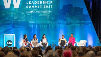 Speakers on stage at Women's Leadership Summit