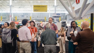 Group of people conversing at AIA conference