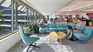 Man working on a couch at the AIA Global Campus for Architecture & Design