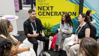 Image of a group of young architects networking at AIA26