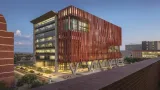 Terracotta exterior of Health Sciences Innovation Building at dusk