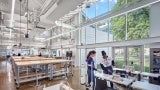 Students working in a large lab at Kent State University, Design Innovation Hub