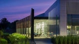 A building with large glass windows at night