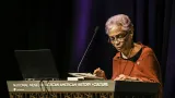 Woman speaking at a podium