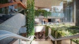 A view from the top of the stairs looking into the lobby and courtyard areas.