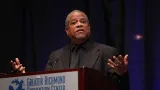 Man speaking at a podium