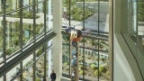 Interior atrium of Seattle Children's Building Care: Diagnostic and Treatment Facility, includes a gathering point and a large story pole.