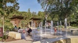 Children playing in fountain of Kingsbury Commons at Pease Park 