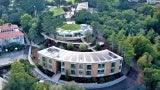 Aerial view of the science and environmental center with exterior canopy walk connecting to the hillside learning complex.