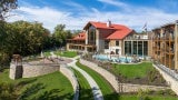 exterior view of a state park lodge with outdoor pool in the foreground