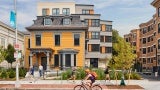 View of adaptive reuse project from the street. Behind the historic structure, there is a new addition. 