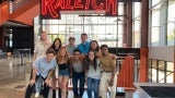 A group of people posed for a photo in a Convention Center 