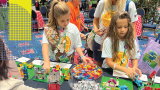 Youth engaging with legos at an architecture event